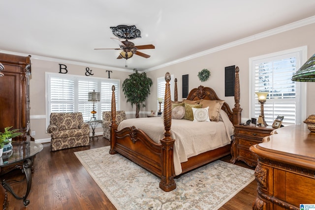 bedroom with multiple windows, dark hardwood / wood-style floors, ceiling fan, and crown molding