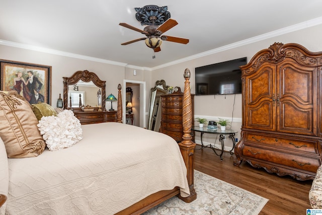 bedroom with ceiling fan, dark hardwood / wood-style flooring, and crown molding