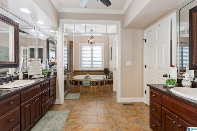 bathroom featuring vanity, crown molding, ceiling fan with notable chandelier, and tiled tub