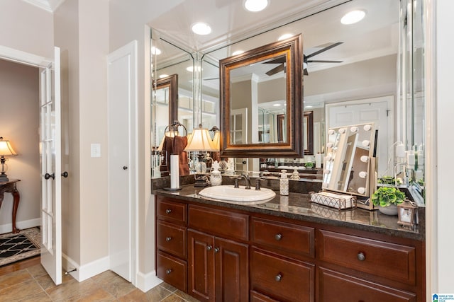 bathroom featuring vanity, ceiling fan, and ornamental molding