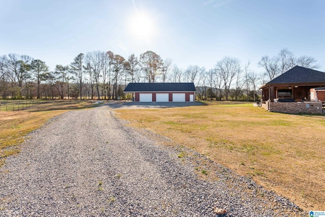 view of front of property with a garage and an outdoor structure