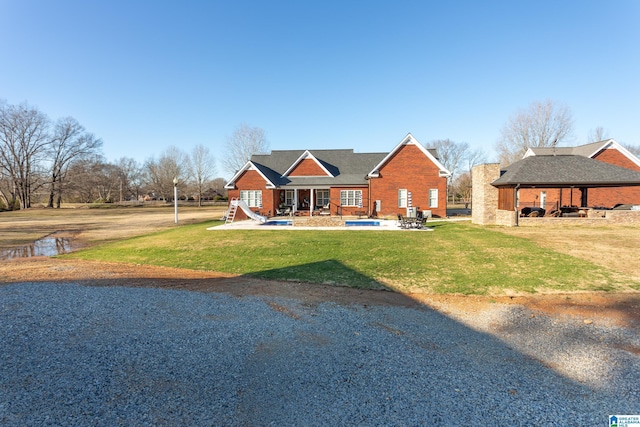 view of front of property with a gazebo and a front yard