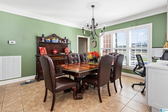 dining room featuring ornamental molding, light tile patterned floors, and a chandelier