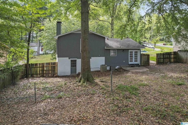 rear view of house featuring french doors