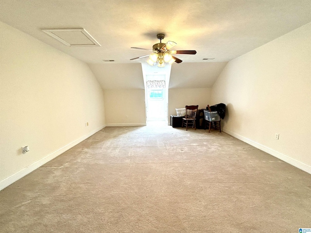 additional living space featuring carpet flooring, ceiling fan, and lofted ceiling