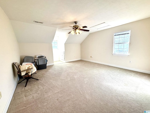 additional living space with light carpet, ceiling fan, and lofted ceiling