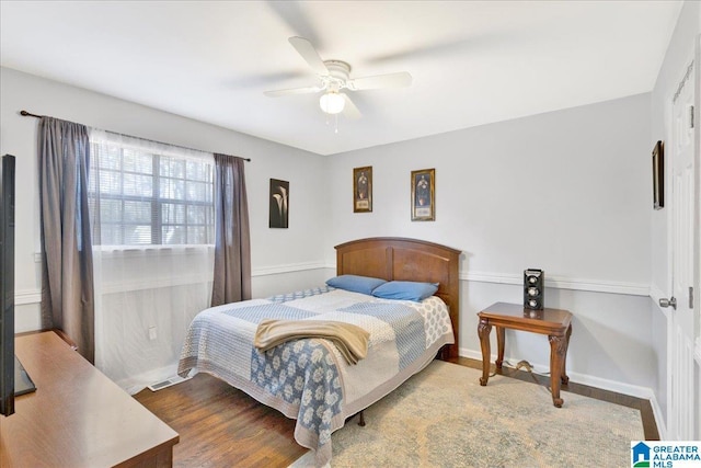 bedroom featuring hardwood / wood-style floors and ceiling fan