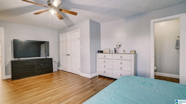 94 Webb Dr, Heflin, AL 36264 - bedroom featuring hardwood / wood-style flooring, ceiling fan, ensuite bathroom, and a textured ceiling