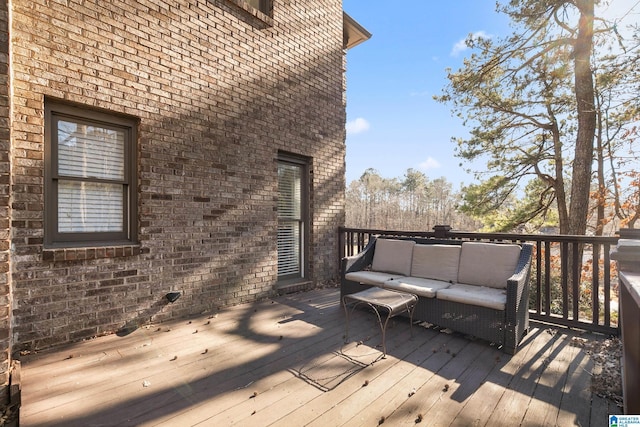 wooden deck with an outdoor living space