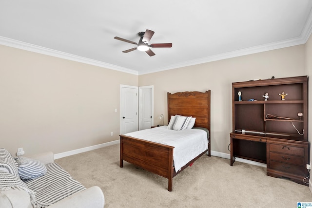 carpeted bedroom featuring ceiling fan and crown molding