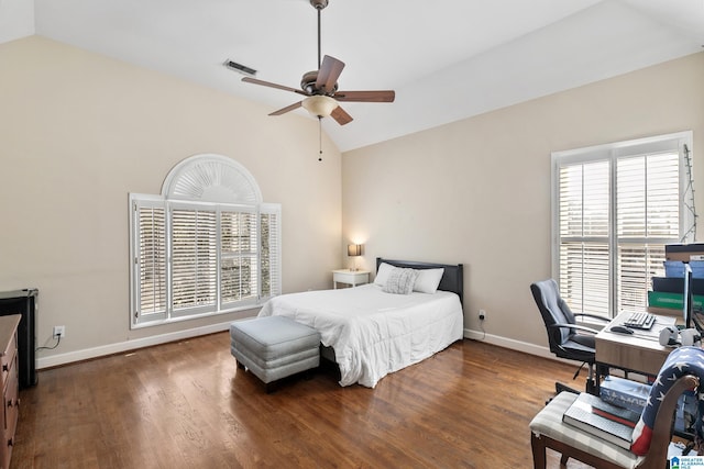 bedroom with ceiling fan, dark hardwood / wood-style flooring, and vaulted ceiling