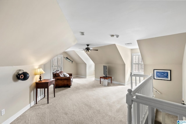 sitting room featuring light colored carpet, ceiling fan, and lofted ceiling