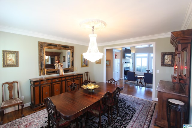 dining room featuring crown molding and hardwood / wood-style floors