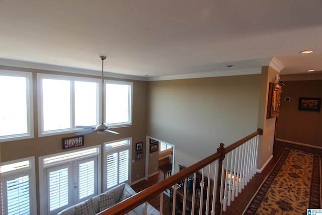 corridor featuring hardwood / wood-style floors, french doors, and ornamental molding