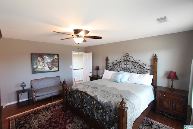 bedroom with ceiling fan and dark hardwood / wood-style flooring