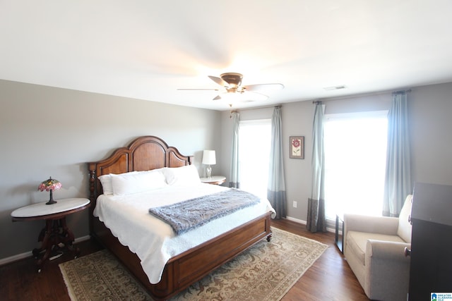 bedroom featuring ceiling fan and dark hardwood / wood-style floors