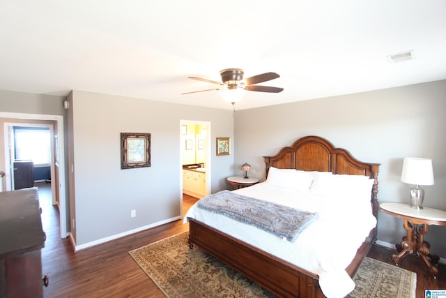 bedroom featuring ensuite bathroom, ceiling fan, and dark wood-type flooring