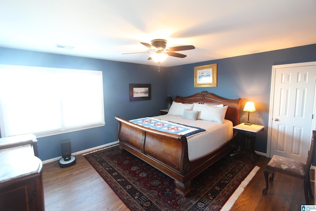 bedroom with ceiling fan and hardwood / wood-style floors