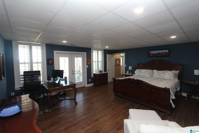 bedroom with access to exterior, french doors, and a paneled ceiling