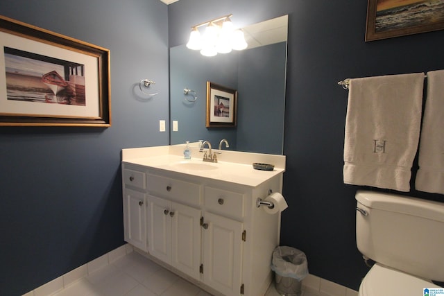 bathroom with tile patterned floors, vanity, and toilet