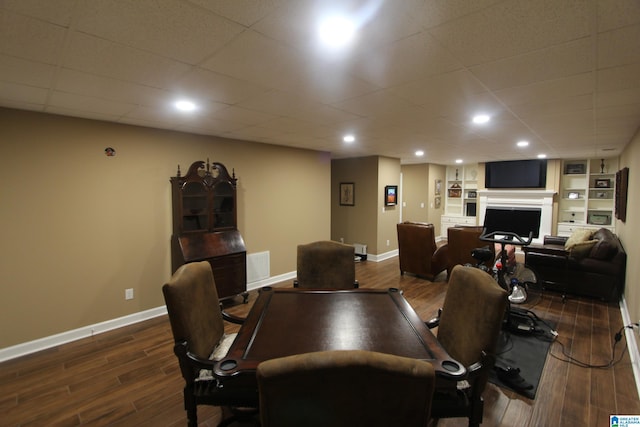 office space with dark wood-type flooring