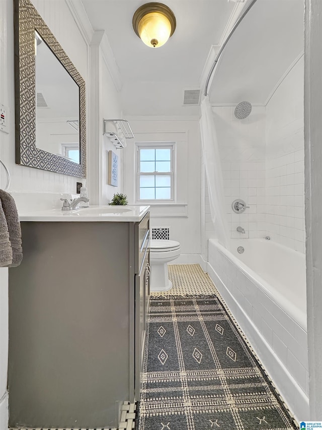 full bathroom featuring vanity, toilet, shower / bathtub combination with curtain, and ornamental molding