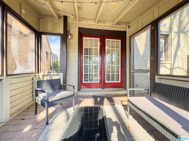 entrance to property featuring a wooden deck