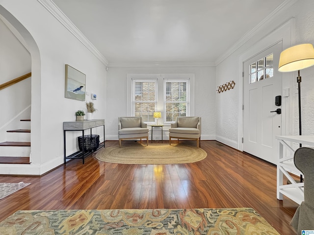 interior space featuring plenty of natural light, ornamental molding, and dark wood-type flooring