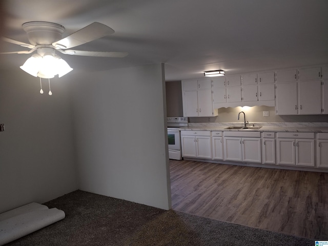 kitchen with sink, white cabinetry, ceiling fan, and electric stove