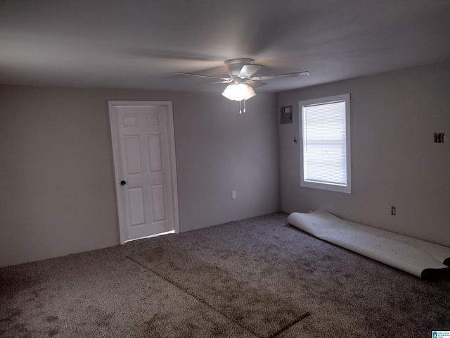 unfurnished room featuring ceiling fan and carpet floors