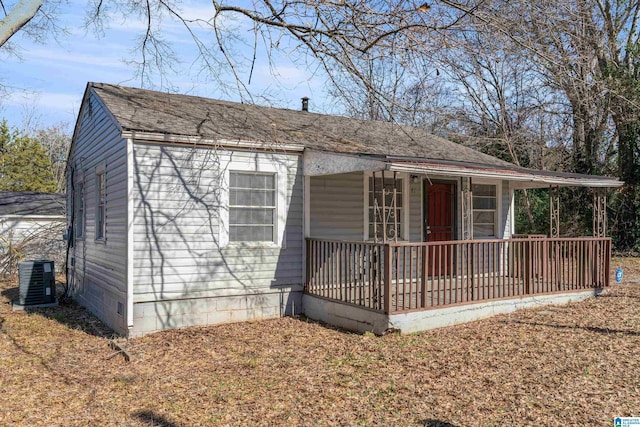 view of front facade with central air condition unit and covered porch