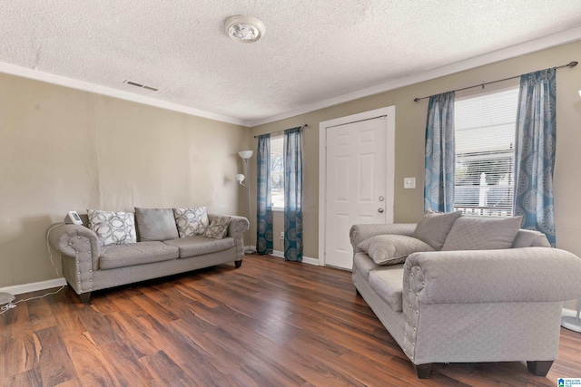 living room featuring dark wood-type flooring and a textured ceiling