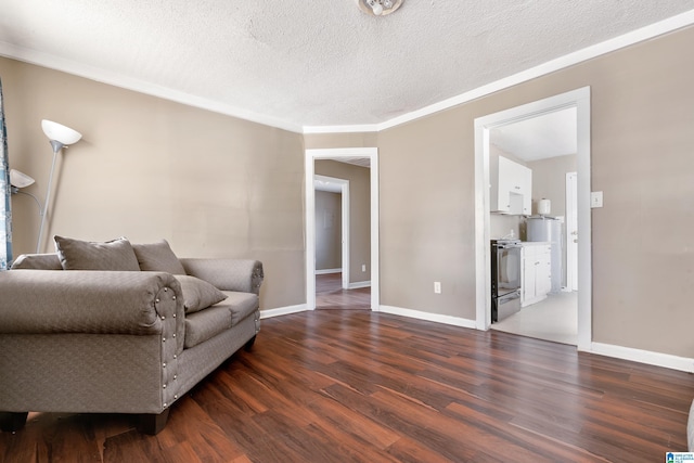 living room with a textured ceiling, crown molding, and dark hardwood / wood-style floors