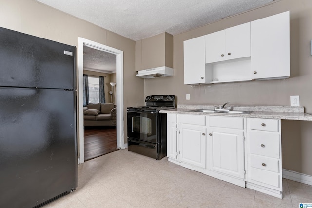 kitchen featuring sink, a textured ceiling, white cabinets, and black appliances