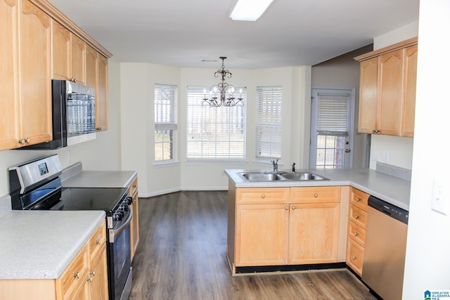 kitchen featuring kitchen peninsula, stainless steel appliances, dark hardwood / wood-style floors, light brown cabinetry, and sink