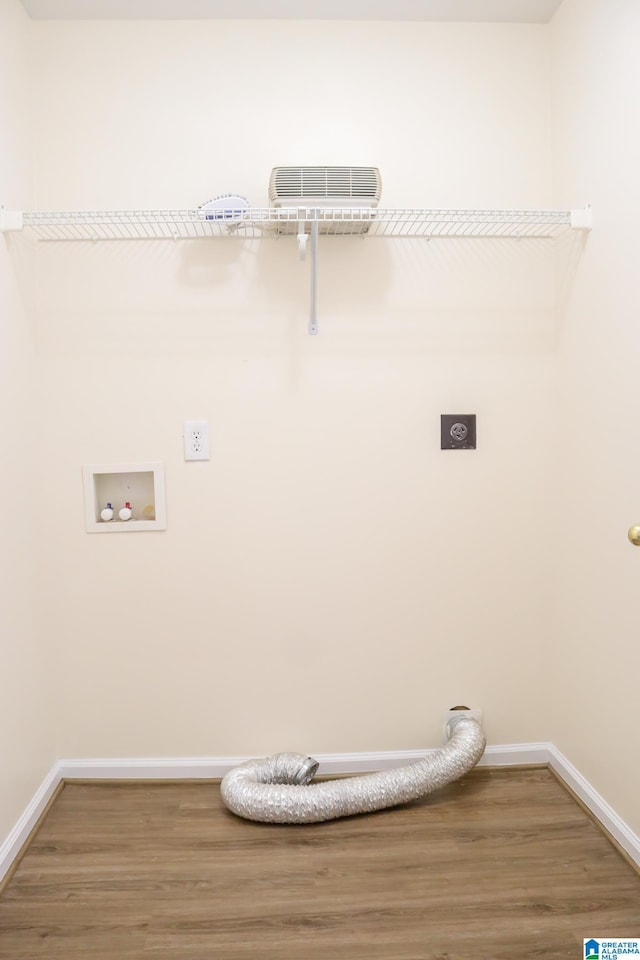 laundry room featuring hardwood / wood-style floors, hookup for a washing machine, and electric dryer hookup