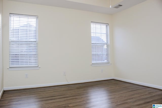 unfurnished room with ceiling fan and dark hardwood / wood-style floors