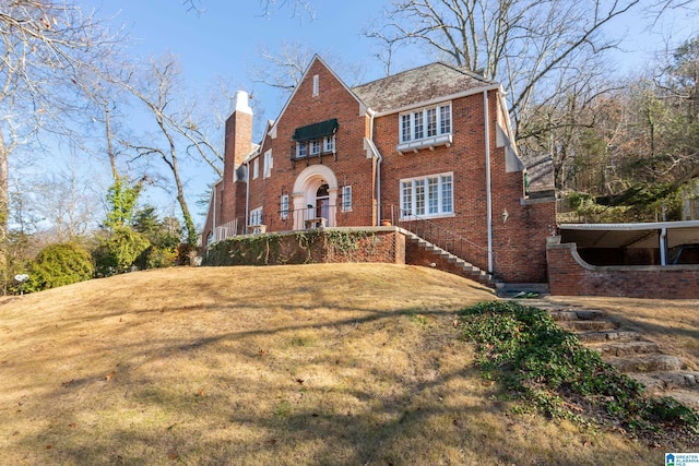 tudor house with a front yard