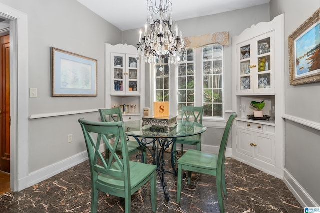 dining space featuring a chandelier