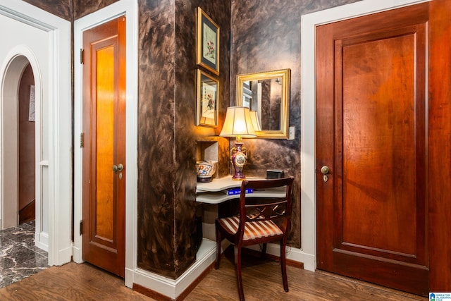 corridor featuring hardwood / wood-style floors