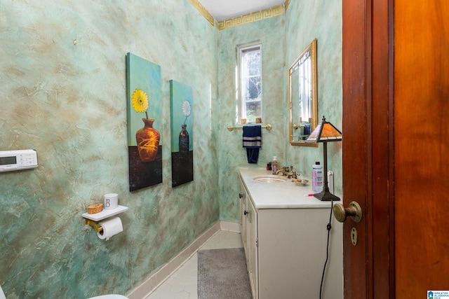 bathroom featuring tile patterned flooring and vanity