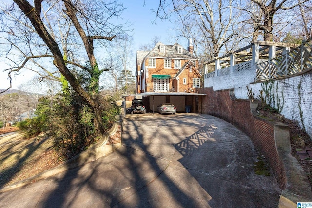 view of patio / terrace featuring a mountain view and a garage