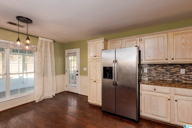 kitchen featuring pendant lighting, dark wood-type flooring, plenty of natural light, backsplash, and stainless steel fridge with ice dispenser