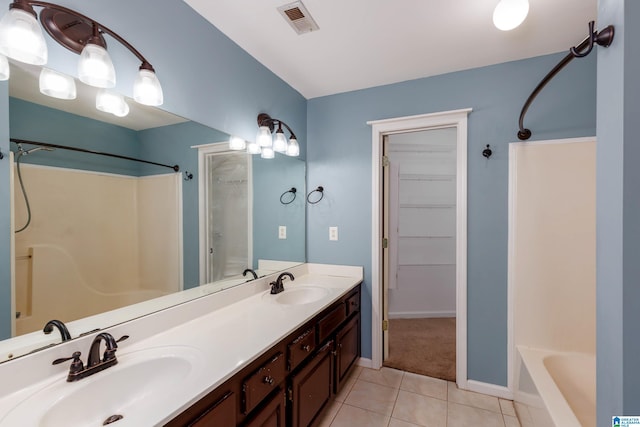 bathroom with vanity and tile patterned flooring