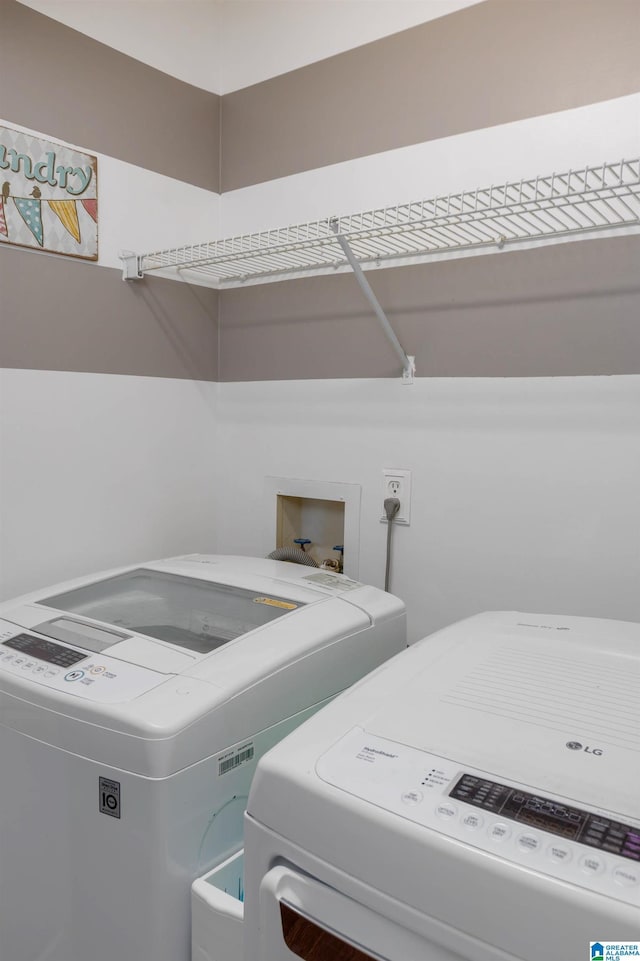 laundry room with washing machine and dryer