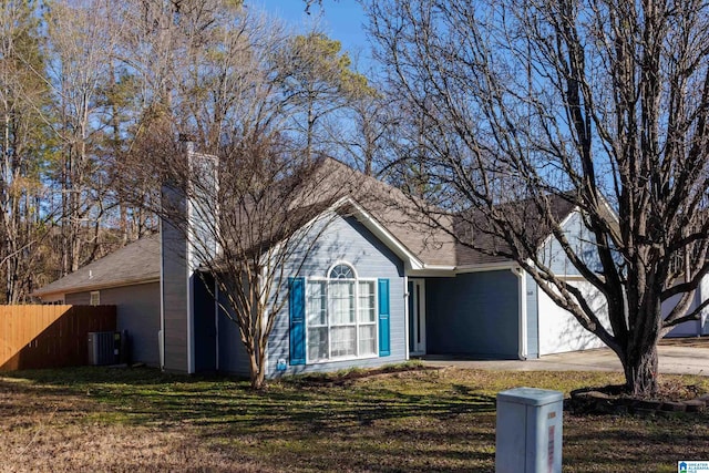 view of front facade with central AC and a front lawn