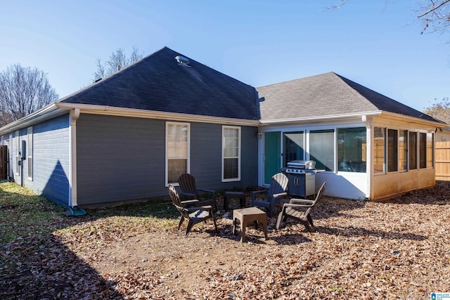 rear view of house with a sunroom