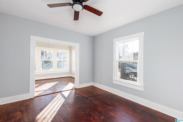 unfurnished room with hardwood / wood-style flooring and ceiling fan