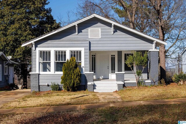 bungalow-style house featuring covered porch