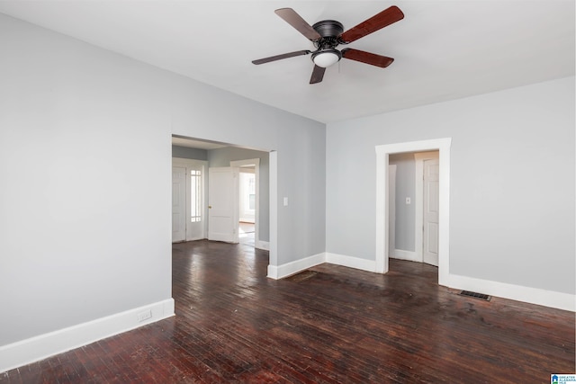 spare room with dark hardwood / wood-style floors and ceiling fan